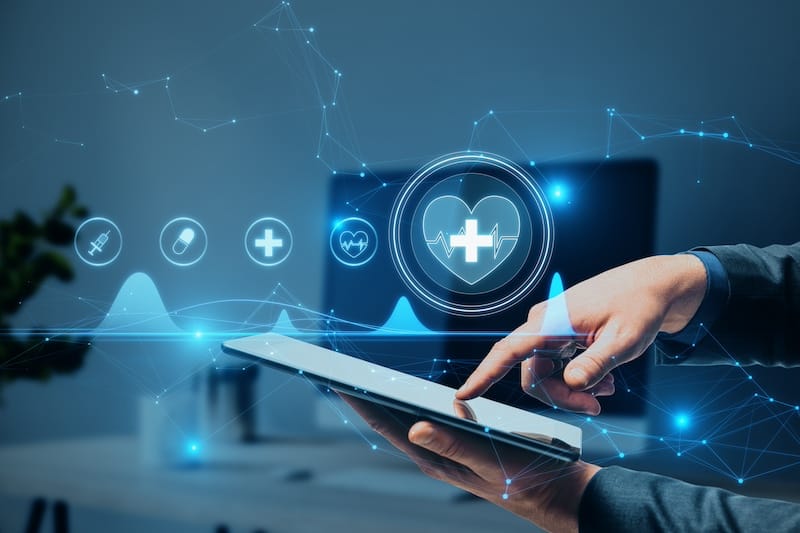 hand pointing at ipad with digital health symbols